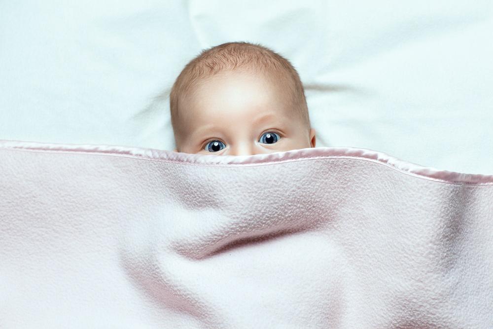 When Can Baby Sleep with A Blanket - The Postpartum Party