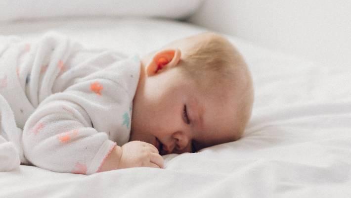 Should I roll my baby back over if she rolls onto her stomach in her sleep? | Stuff.co.nz